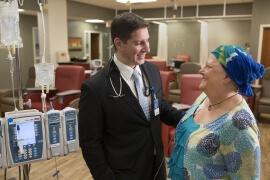 Dr. Basem Goueli, Medical Director of St. Luke’s Regional Cancer Center, talks with patient Taire Suliin in the Cancer Center’s infusion therapy clinic